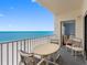 Balcony with ocean view and outdoor seating area at 13500 Gulf Blvd # 706, Madeira Beach, FL 33708