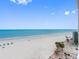 Expansive beach view with clear blue skies and ocean at 13500 Gulf Blvd # 706, Madeira Beach, FL 33708