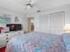 Bedroom showcases closet, view, and dresser with TV at 13500 Gulf Blvd # 706, Madeira Beach, FL 33708