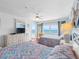 Bright bedroom with two beds, dresser and ocean view and a balcony access at 13500 Gulf Blvd # 706, Madeira Beach, FL 33708