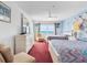 Bright bedroom with ocean view, two beds, and dresser at 13500 Gulf Blvd # 706, Madeira Beach, FL 33708