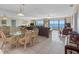Bright and airy living room with tile floors, ocean views, and comfortable seating at 13500 Gulf Blvd # 706, Madeira Beach, FL 33708
