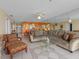 Spacious living room with comfortable seating, tile flooring, and lots of natural light at 13500 Gulf Blvd # 706, Madeira Beach, FL 33708