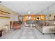 Spacious living room with tile floors and comfortable sectional sofa at 13500 Gulf Blvd # 706, Madeira Beach, FL 33708