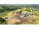 An aerial shot of community baseball fields surrounded by lush green space and residential areas at 13727 Whiskey Daisy Dr, Dade City, FL 33525