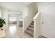 Bright foyer leading to an open-concept living area and staircase at 13727 Whiskey Daisy Dr, Dade City, FL 33525