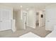 Upstairs hallway featuring multiple bedrooms and bathrooms, showcasing a functional layout at 13727 Whiskey Daisy Dr, Dade City, FL 33525