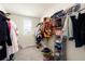 Spacious walk-in closet with ample hanging space and shelving for organized storage at 13727 Whiskey Daisy Dr, Dade City, FL 33525