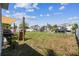 Waterfront backyard offers ample green space with the convenience of canal access, ideal for boating enthusiasts at 13920 Berkowitz Ave, Hudson, FL 34667