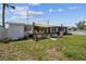 Cozy backyard featuring outdoor seating and a grill, perfect for entertaining and enjoying outdoor meals at 13920 Berkowitz Ave, Hudson, FL 34667