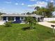 Attractive single-Gathering home featuring a well-manicured lawn and landscaped yard, perfect for a Gathering at 13920 Berkowitz Ave, Hudson, FL 34667