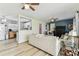 Cozy living room with comfortable seating, stylish decor, and an open flow to the kitchen at 13920 Berkowitz Ave, Hudson, FL 34667