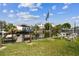 Scenic canal-front property featuring a dock and boat lift, offering easy access to waterways for boating and recreation at 13920 Berkowitz Ave, Hudson, FL 34667