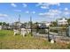 Tranquil waterfront area with seating, providing serene canal views and an excellent outdoor relaxation space at 13920 Berkowitz Ave, Hudson, FL 34667
