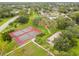 Aerial view of the tennis courts and a playground among the green spaces at 14170 Fennsbury Dr, Tampa, FL 33624