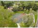 Aerial view of basketball court surrounded by lush trees and greenery at 14170 Fennsbury Dr, Tampa, FL 33624