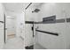 Glass shower with modern tile and black hardware provides a contemporary feel at 14170 Fennsbury Dr, Tampa, FL 33624