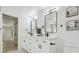 Bright bathroom with a double sink vanity, sleek black hardware, and decorative wall art at 14170 Fennsbury Dr, Tampa, FL 33624