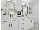 Modern bathroom with double vanity, sleek black fixtures, and large mirrors at 14170 Fennsbury Dr, Tampa, FL 33624