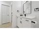 Clean, bright bathroom features white vanity, modern hardware, and ample storage at 14170 Fennsbury Dr, Tampa, FL 33624