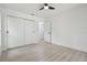 Bright bedroom with ample closet space and modern ceiling fan, features neutral design at 14170 Fennsbury Dr, Tampa, FL 33624