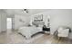 Bright bedroom features a ceiling fan, shuttered windows, and stylish decor at 14170 Fennsbury Dr, Tampa, FL 33624