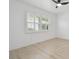 Modern bedroom flooded with natural light through shuttered window at 14170 Fennsbury Dr, Tampa, FL 33624