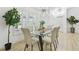 Elegant dining room features a modern chandelier and large window with plantation shutters at 14170 Fennsbury Dr, Tampa, FL 33624