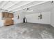Spacious garage with cabinets for storage and a utility sink at 14170 Fennsbury Dr, Tampa, FL 33624