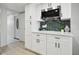 Stylish kitchen with stainless steel appliances, quartz countertops, and a tile backsplash at 14170 Fennsbury Dr, Tampa, FL 33624