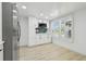 Bright kitchenette featuring ample counter space, stainless steel appliances, and shuttered windows at 14170 Fennsbury Dr, Tampa, FL 33624