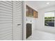 Bright laundry room with extra storage and folding space for your convenience at 14170 Fennsbury Dr, Tampa, FL 33624