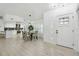 Open-concept living area seamlessly connects kitchen and dining, bathed in natural light at 14170 Fennsbury Dr, Tampa, FL 33624