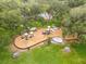 Aerial view of a well-maintained playground with slides, and play structures nestled among mature trees and lush green grass at 14170 Fennsbury Dr, Tampa, FL 33624