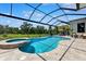 Enjoy this screened-in pool with attached spa and backyard views at 15936 Ternglade Dr, Lithia, FL 33547
