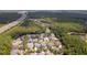 Scenic aerial view of a vibrant community surrounded by a conservation area and tranquil waterscapes at 16170 Colchester Palms Dr, Tampa, FL 33647