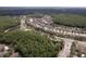 Community aerial view showing winding roads, picturesque homes, and beautiful green landscapes at 16170 Colchester Palms Dr, Tampa, FL 33647