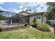 Spacious backyard with a screened-in pool area and lush green lawn at 16170 Colchester Palms Dr, Tampa, FL 33647