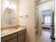 Half bathroom with granite countertop, gray vanity, and brushed nickel faucet at 16170 Colchester Palms Dr, Tampa, FL 33647
