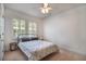 A bedroom with plantation shutters and ceiling fan at 16170 Colchester Palms Dr, Tampa, FL 33647