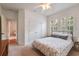 A bedroom features a window with plantation shutters and a double door closet at 16170 Colchester Palms Dr, Tampa, FL 33647