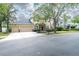 Inviting two-story home with a three-car garage, well-manicured lawn, and a charming front entrance at 16170 Colchester Palms Dr, Tampa, FL 33647