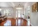 Bright foyer featuring hardwood floors, an elegant front door, and decorative details for a welcoming entrance at 16170 Colchester Palms Dr, Tampa, FL 33647