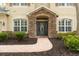 Inviting front entrance with a stone archway and decorative glass door at 16170 Colchester Palms Dr, Tampa, FL 33647