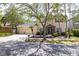 Beautiful home with a three-car garage, and a decorative stone archway above the main entrance at 16170 Colchester Palms Dr, Tampa, FL 33647