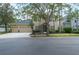 Charming two-story home featuring a spacious three-car garage and a welcoming front entrance with stone accents at 16170 Colchester Palms Dr, Tampa, FL 33647
