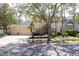 Attractive home with a three-car garage, pretty landscaping, and an impressive, stone-detailed entrance at 16170 Colchester Palms Dr, Tampa, FL 33647