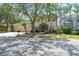 Charming two-story home featuring a three-car garage and meticulously landscaped front yard at 16170 Colchester Palms Dr, Tampa, FL 33647