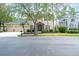 Desirable home featuring a three-car garage, tidy landscaping, and an elegant, stone-accented entrance at 16170 Colchester Palms Dr, Tampa, FL 33647
