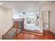 Bright living room with wood floors, soft carpet, staircase, and ample natural light at 16170 Colchester Palms Dr, Tampa, FL 33647